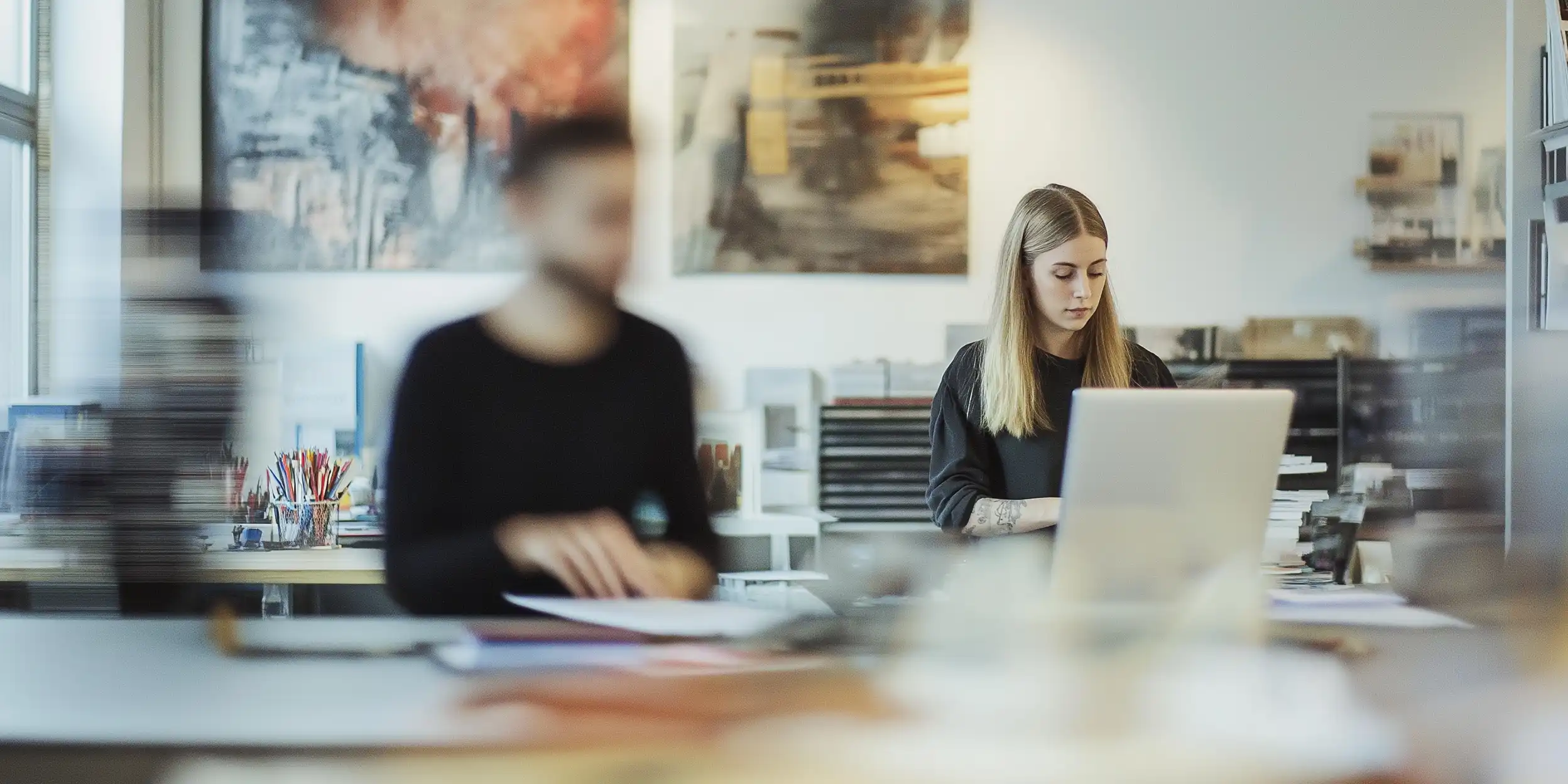 Two people working in a creative office